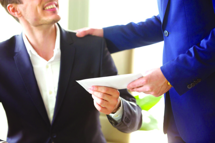 Boss congratulating employee with getting reward