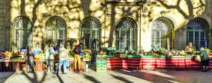 local people buy fresh vegetables and fruits at the local market