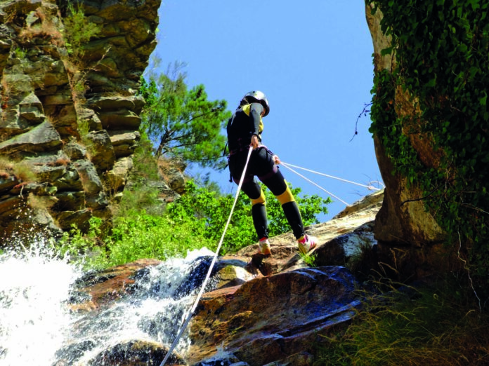 Woman descending on rappel